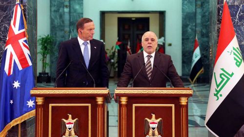 Abbott pledges more aid for Iraq in surprise visit to Baghdad