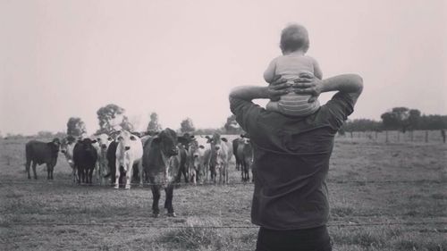 Memphis on the shoulders of his father, Michael.