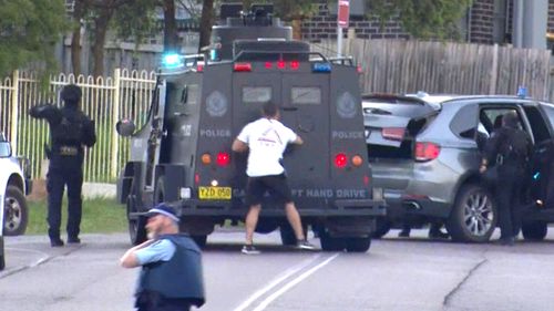 Police duck for cover after a Wyong man allegedly began firing into the street.