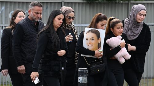 Family and friends of Amneh Amy al-Hazouri walk towards Lakemba Mosque for her funeral, Lakemba, NSW. 26th August, 2022. Photo: Kate Geraghty