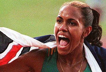 Where did Cathy Freeman win her first Olympic medal?