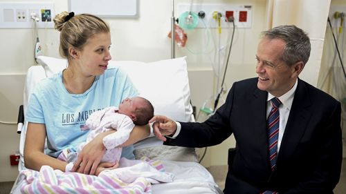 Bill Shorten speaks to mother Cassandra and her one-day old daughter Myah during a visit to the maternity ward at Casey Hospital in Berwick in Melbourne.