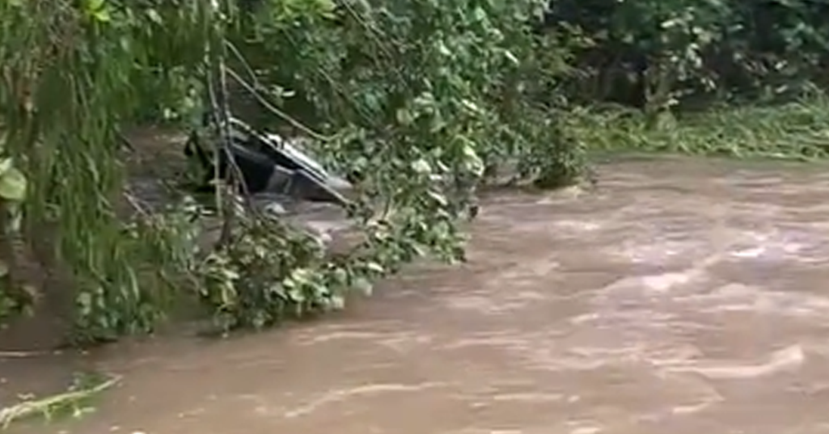 Woman dies after car is swept away by floodwaters as North Queensland hit with torrential rain – 9News