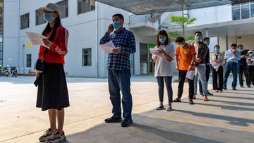 n this photo released by Xinhua News Agency, residents wearing masks line up for COVID-19 vaccination at the Jingcheng Hospital in Ruili city in southwestern China&#x27;s Yunnan Province, April 1, 2021. 