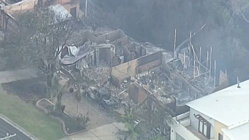 Strong winds are expected to create more dramas for fire crews working to contain the Tathra fire. (9NEWS)