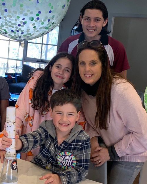 Julie Rosenbloom with her three kids, Kade (front), Anika (left) and Brody (back).