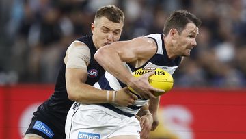 MELBOURNE, AUSTRALIA - MARCH 23: Patrick Dangerfield of the Cats is tackled by Patrick Cripps of the Blues during the round two AFL match between Carlton Blues and Geelong Cats at Melbourne Cricket Ground, on March 23, 2023, in Melbourne, Australia. (Photo by Daniel Pockett/Getty Images)