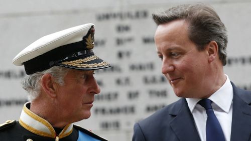 The Prince of Wales and British Prime Minister David Cameron share a moment in Glasgow. (Getty)