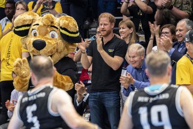 Prince Harry, center, watches the France against Great Britain wheelchair rugby match at the Invictus Games in Duesseldorf, Germany, Sunday, Sept. 10, 2023. 