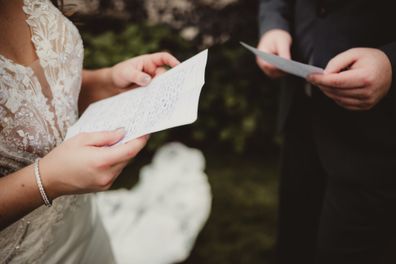 Bride and groom saying wedding vows during ceremony