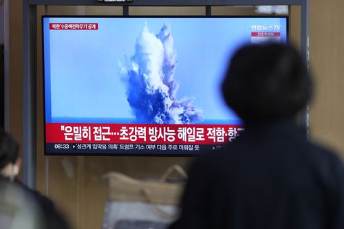 A TV screen shows a recent image released by Pyongyangs official Korean Central News Agency during a news program at the Seoul Railway Station in Seoul, South Korea, Friday, March 24, 2023. 