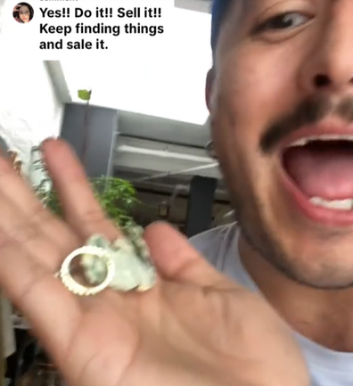 man flips trash finds money and ring