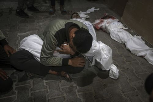 A Palestinian youth mourns his relative killed in the Israeli bombardment of the Gaza Strip.