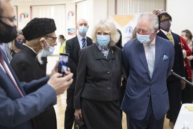 Prince Charles, Prince of Wales and Camilla, Duchess of Cornwall wear face masks as they visit a vaccination pop-up centre at Finsbury Park Mosque on March 16, 2021 in London, England.