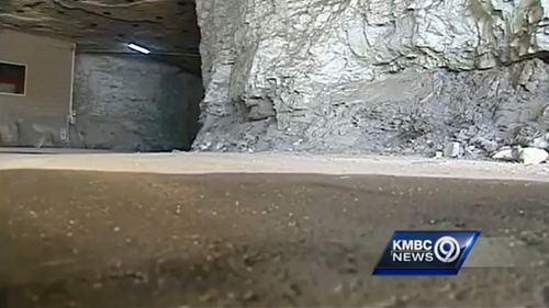 The childrens' mother reportedly told police they had been living in the large, wet, dirt floor cave for several days without supervision. (KMBC News)