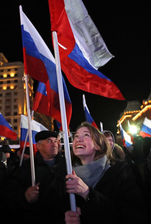 Russians have taken to the streets to celebrate Mr Putin's re-election. (AAP)