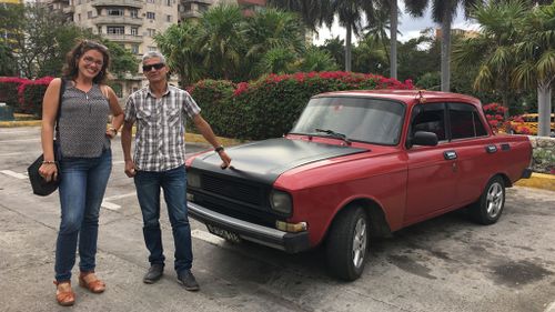 Claudia and Manuel beside the 'Red Rocket'. (Laura Turner)