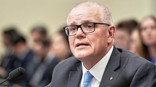 Former Australian Prime Minister Scott Morrison testifies during a House Select Committee on China hearing at the on Capitol Hill, Wednesday, July 23, 2025, in Washington. (AP Photo/Mariam Zuhaib)