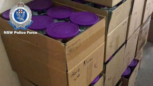 Some of the 4000 tins of baby formula found during a police raid last year.