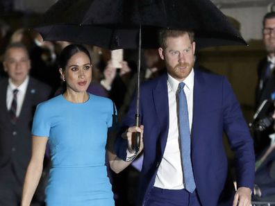 Harry and Meghan arrive at the annual Endeavour Fund Awards in London in the rain.