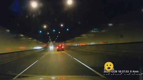 Dash cam shows the car moving across lanes in the Melbourne tunnel.