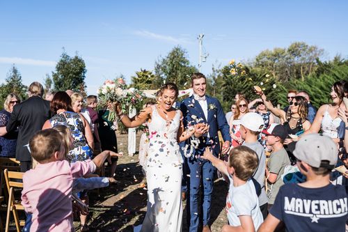 Twenty students donning ring pops lined the aisle of Mikhala Fisher’s wedding day to make it complete. Picture: Carmen Bunting Photography