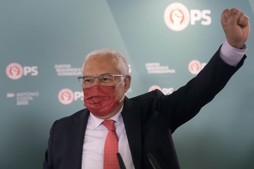 Portuguese Prime Minister and Socialist Party Secretary General Antonio Costa raises his fist to supporters following election results in which Portugal's center-left Socialist Party won a third straight general election, returning it to power, Lisbon, Monday, Jan. 31, 2022.