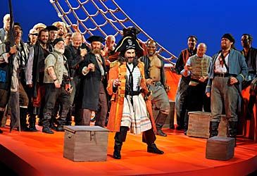 When was Gilbert and Sullivan's The Pirates of Penzance first performed on stage?