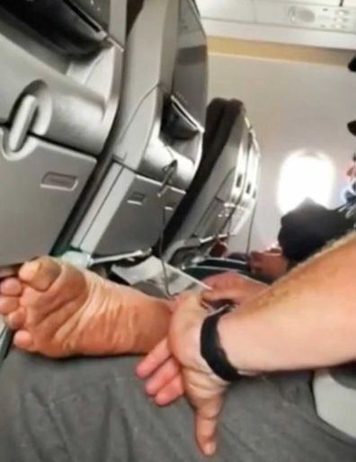 Passenger Shaming viral video: man picks at dirty foot with pinky