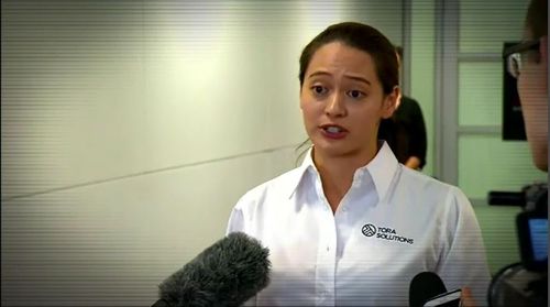 Meanwhile, a press conference to distract waiting reporters was being held in another part of Brisbane Airport. Picture: 9NEWS.