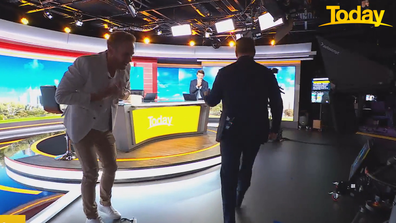 Tim hunched down in shock as a stoked Karl walked back to the news desk.