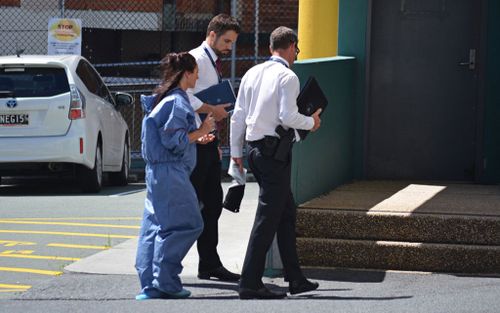 Police take Pania Lawrence, 39, to Southport Watchhouse after a 46-year-old man was fatally shot. (Image: AAP)