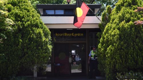 A police officer guards the entry to the Lobby Restaurant. (AAP)