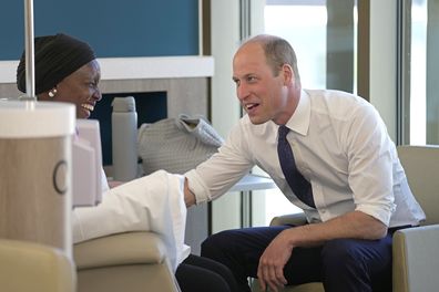 Prince William, right, talks to a patient as he attends the official opening of the Oak Cancer Centre at The Royal Marsden Hospital in London, Thursday, June 8, 2023
