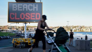 A &#x27;beach closed&#x27; sign is seen at Bondi Beach in Sydney.
