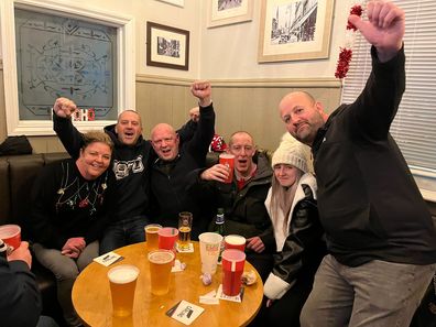 Wrexham FC fans celebrates Wrexham's 2-1 win over Colchester on December 16, 2023 inside The Turf pub