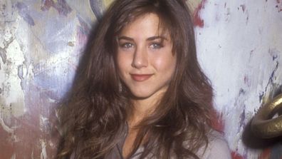 Before she sported the more flattering "Rachel cut" on <i>Friends</i>, Jennifer Aniston had seriously mousey brown hair.