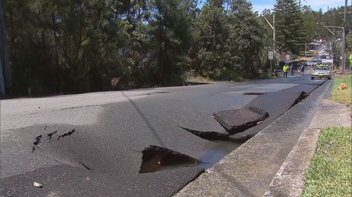 The road surface is buckled in some areas.