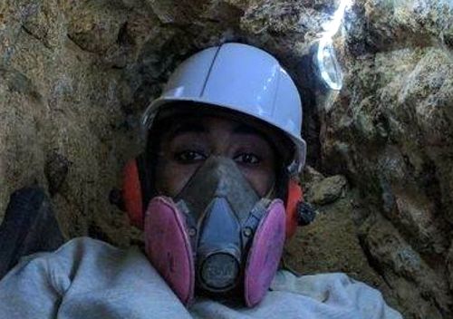 Prosecutors contend Askia Khafra (pictured here working in the tunnel) slept and ate at the house, and went to the bathroom in a bucket. (Montgomery County Court)