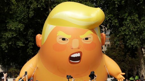 Full of hot air: The baby Trump blimp was inflated for the US president's arrival on Friday. Picture: AAP
