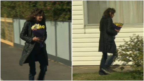 Local woman, Lee, left flowers at the girls' home. 