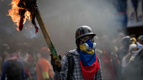 Protesters have continued to clash with police in opposition of the Maduro regime. (AFP)