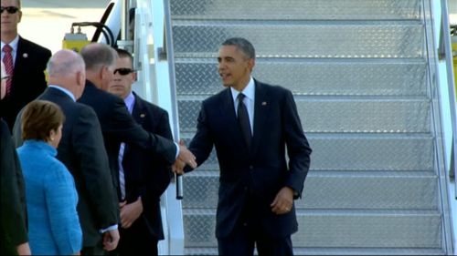 Mr Obama is greeted upon his arrival in Brisbane. (9NEWS)