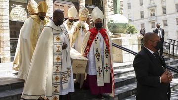 Pallbearers carry the casket holding the body of Archbishop Desmond Tutu after the funeral service in St. George&#x27;s Cathedral in Cape Town, South Africa, Saturday, Jan. 1, 2022. 