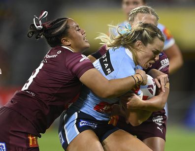 TOWNSVILLE, AUSTRALIA - JUNE 22: Emma Tonegato of the Blues is tackled during game two of the women's state of origin series between New South Wales Skyblues and Queensland Maroons at Queensland Country Bank Stadium on June 22, 2023 in Townsville, Australia. (Photo by Ian Hitchcock/Getty Images)