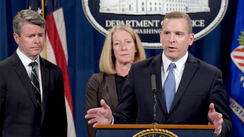FBI Executive Director Paul Abbate (right), accompanied by US Attorney for the Northern District Brian Stretch and Acting Assistant Attorney General Mary McCord, speaks during a news conference at the Justice Department in Washington. (AAP)