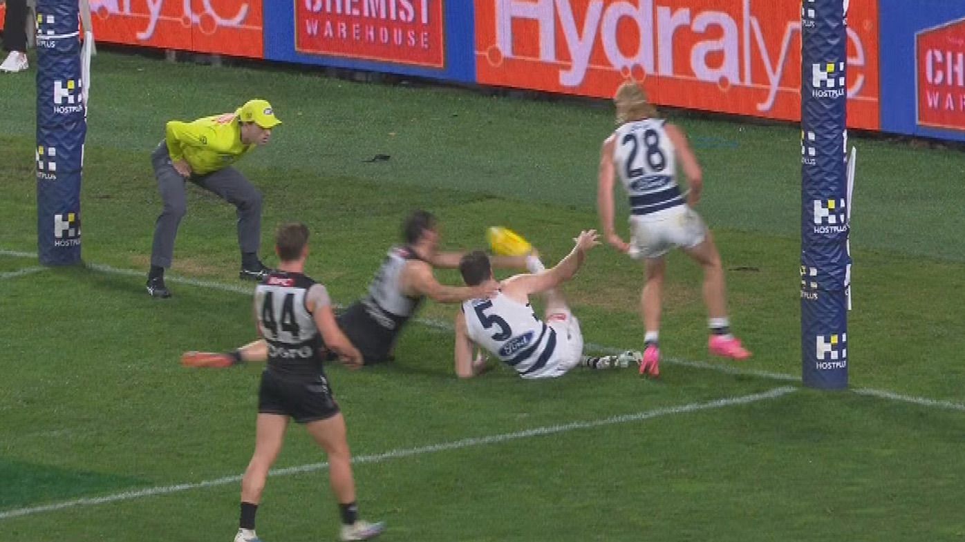Despite the umpire blowing the whistle, many players played on and Jeremy Cameron toed through this goal, but was denied.