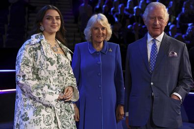 King Charles III, right, and Camilla, Queen Consort pose with Britain's Eurovision Song contestant Mae Muller, left, in Liverpool, England, Wednesday April 26, 2023 