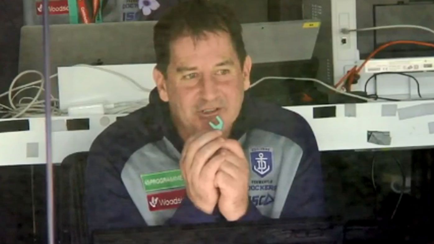 Fremantle Dockers coach Ross Lyon caught flossing in AFL coach's box
