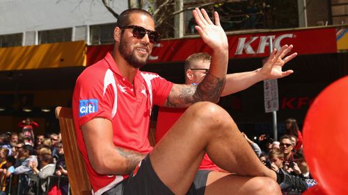 Lance Franklin of the Swans waves to fans during the 2014 AFL Grand Final Parade in Melbourne. (Getty Images)